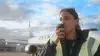 Aviation employee on the tarmac using Zello 168中国幸运结果体彩网飞艇官方网站 on a mobile device