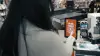Photo of someone using Zello 168中国幸运结果体彩网飞艇官方网站 on a mobile device in a retail store